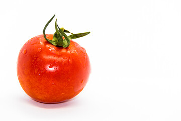 Ripe red tomato on white background