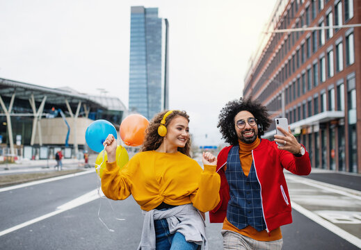 Young Couple With Smartphone Making Video Outdoors On Street, Tik Tok Concept.