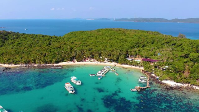 Aerial view of beautiful landscape, tourism boats, and people swimming on the sea and beach on May Rut island (a tranquil island with beautiful beach) in Phu Quoc, Kien Giang, Vietnam.