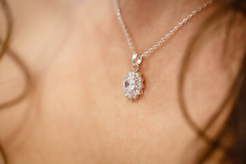 Silver Necklace on the female breast