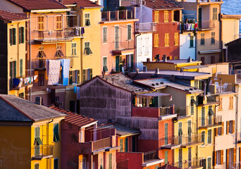 Fototapeta na wymiar Colourful house frontings forming a beautiful background pattern. Cinque Terre, Italy.