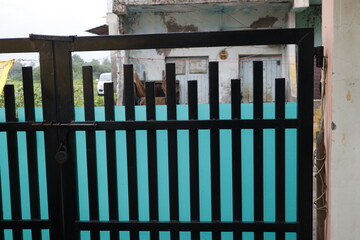 black gate with blue cover