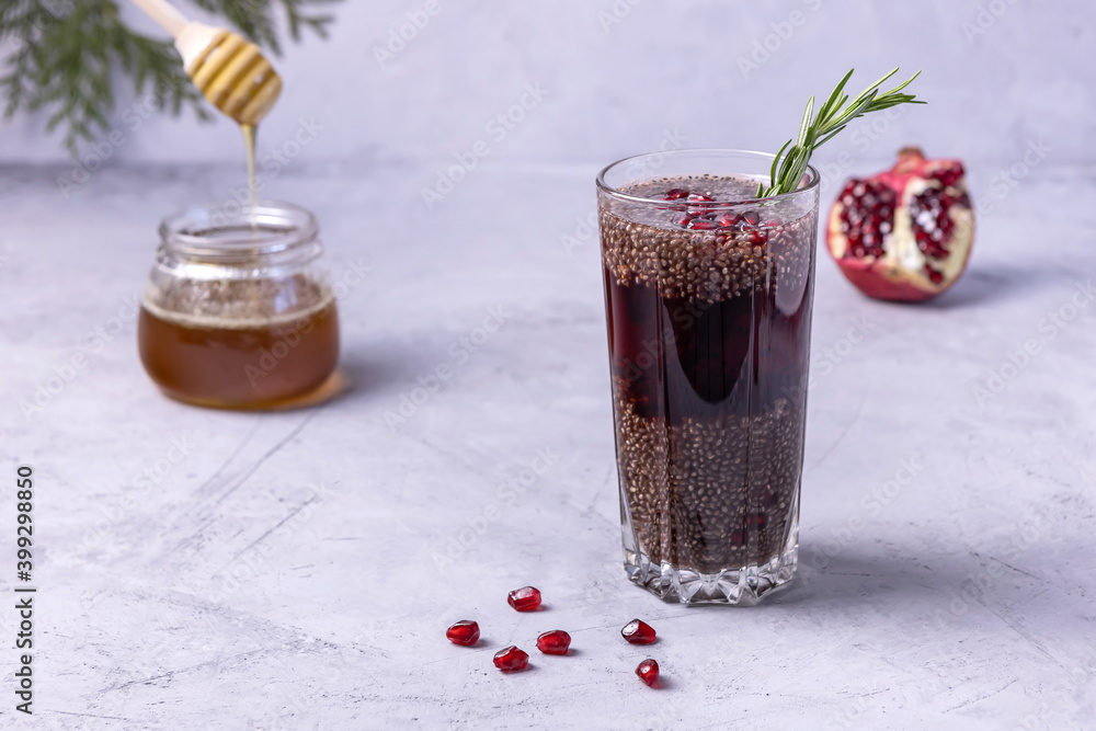 Wall mural tea with pomegranate, chia seeds, honey and rosemary. healthy drink