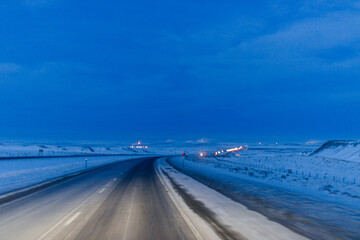 Night winter snow highway with cars and trucks