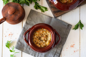 Pearl barley with meat in a clay pot for lunch