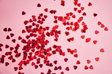 Valentine day background. Red hearts on pink background