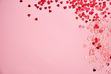 Fototapeta na wymiar Valentine day background. Red hearts on pink background