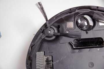 Clean brush cleaned and installed on the robot vacuum cleaner, close-up.