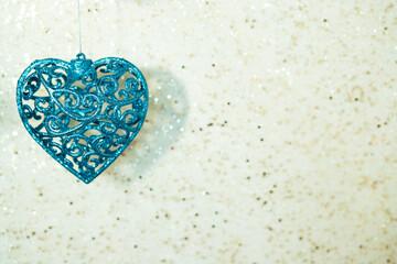 heart toy christmas tree blue christmas on a shiny background with copy space