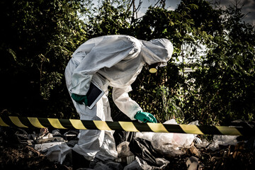 Asian scientist wear Chemical protection suit check danger chemical,working at dangerous zone,Collecting samples in case of Corona virus investigation outbreaked from China.