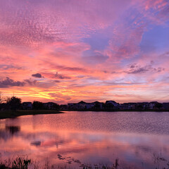 Beautiful pink, orange and blue sunset reflecting on a lake