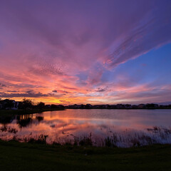 Beautiful pink, orange and blue sunset reflecting on a lake