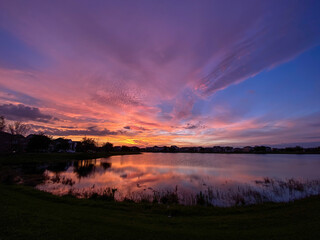 Beautiful pink, orange and blue sunset reflecting on a lake