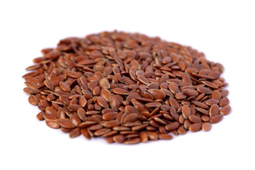 Close-up of flax seeds isolated on white background