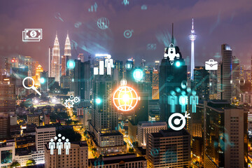 Research and technological development glowing icons. Night panoramic city view of Kuala Lumpur....