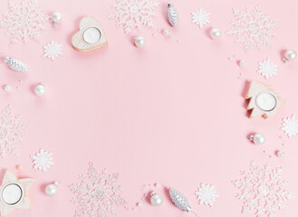 Pink Christmas holiday composition. Festive creative pink pattern, xmas decor holiday ball with snowflakes on pink background.