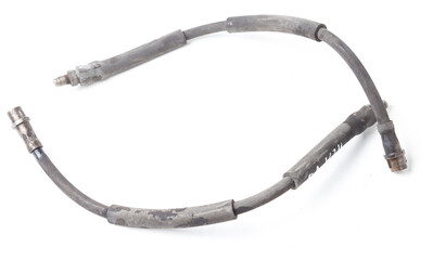 Pair of old brake hoses on white background in photo studio - a high-pressure hose with fluid and metal nozzles for replacement during repairs or for catalog of spare parts for sale on auto parsing.