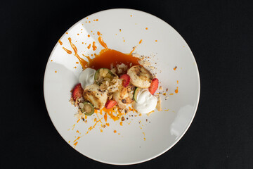 Cottage cheese pancakes with sour cream and almond flakes and sea buckthorn-orange sauce