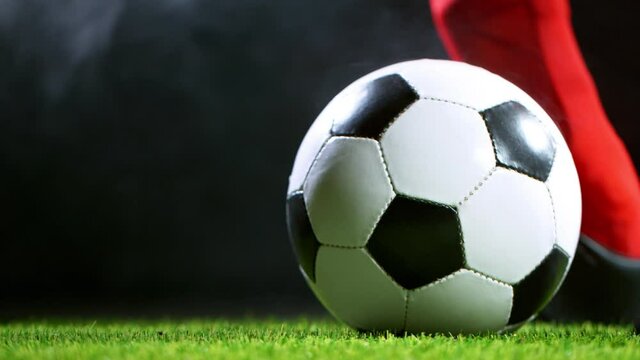 Close-up Foot Kicking Soccer Ball, Super Slow Motion at 1000 fps.