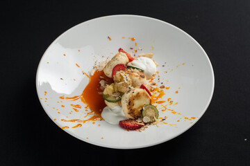 Cottage cheese pancakes with sour cream and almond flakes and sea buckthorn-orange sauce