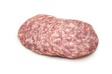 Closeup of sliced salami sausage on white background