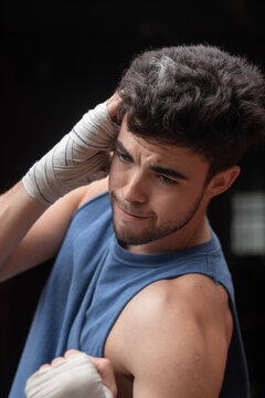 male trainning boxing in handwraps