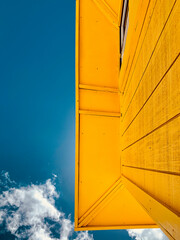 Yellow roof against a blue sky