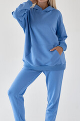 woman wears azure blue textile sport outfit