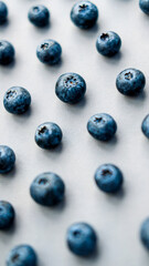 blueberries are placed on a dark gray background