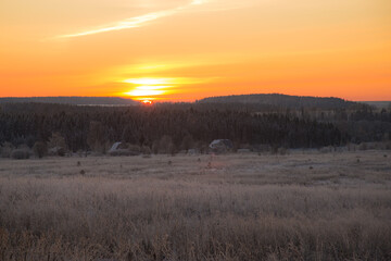 the first rays of the rising sun paint the clear sky in beautiful colors