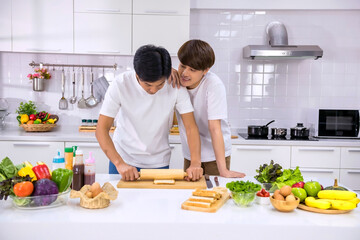 Asian LBGT gay couple make sandwich in kitchen