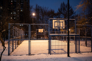 magic of night city park after falling snow in low light