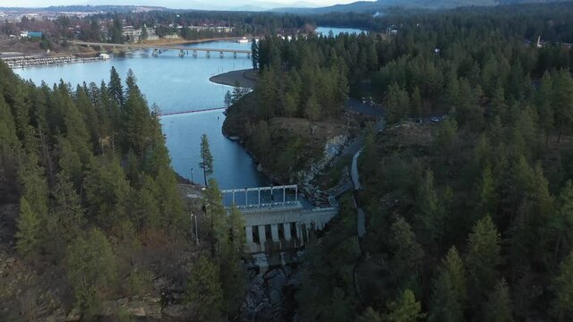 Aerial drone over Post Falls Idaho dam on the Spokane River with trees