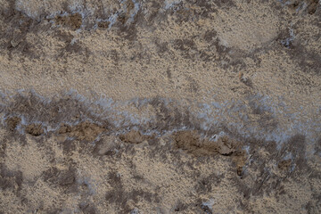 land area with patterned river sand near the river