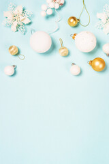Christmas copmosition with holidays decorations. Flat lay image on blue background.