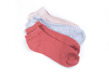 several pairs of short socks on a white background, top view