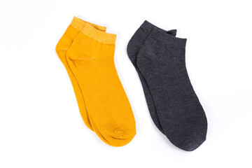 two pairs of colored short socks on a white background, top view