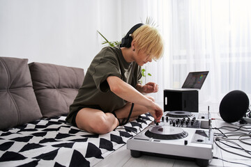 Woman adjusting her dj console