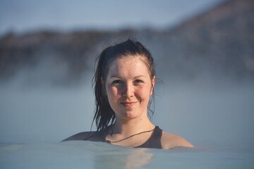 Enjoying hot thermal spa pool in Iceland