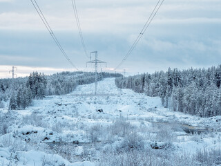 Power towers in the snow-capped northern mountains