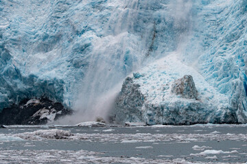The terminal face of the Holgate Glacier, Alaska with falling ice