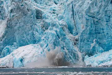 The terminal face of the Holgate Glacier, Alaska with falling ice
