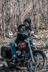 Biker portrait. Photo with a motorcycle