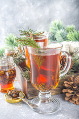 Pine Cone tea, aromatic organic winter hot tea drink with pine branch and pine cone jam, sweet and healthy winter drink concept