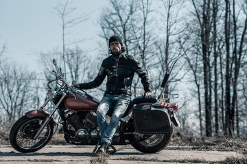 Plakat Biker portrait. Photo with a motorcycle