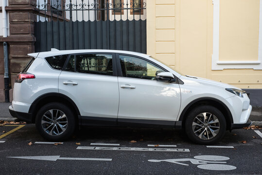 Mulhouse - France - 14 December 2020 - Profile view of white Toyota rav4 SUV parked in the street