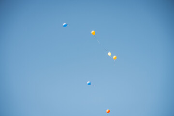 colorful balloons flying in the blue sky,