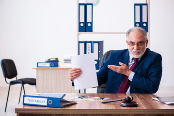 Experienced male judge sitting in the office