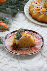 A slice of Christmas cake decorated with tangerine slices