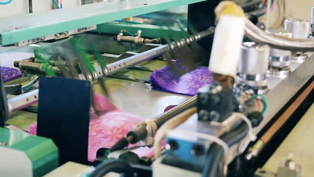 Plastic bag cutting machine at a polyethylene manufacturing factory